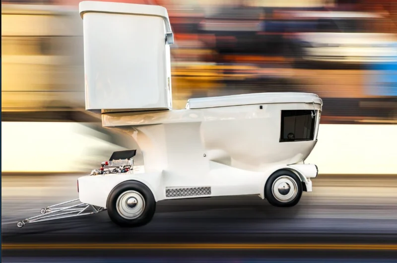 Side profile of the Toilet Car in motion